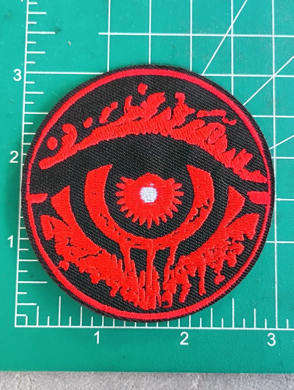 Cool Red And Back Eye Round Grunge Iron On Patch